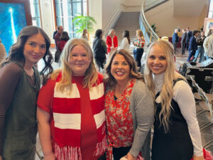 Media representatives with children at The Giving Machine event