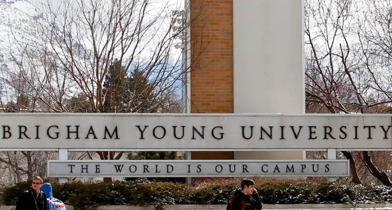 Students walks past the entrance of Brigham Young University on March 1, 2012 in Provo, Utah.