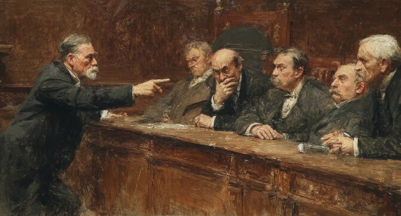 An elected official scolds a colleague in a government chamber, reflecting breakdowns in political leadership and dignity.