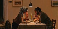 A Jewish couple shares a quiet shabbat dinner, in a moment of faith in marriage.