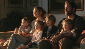 A family watching the best family movies you've never heard of together at home.