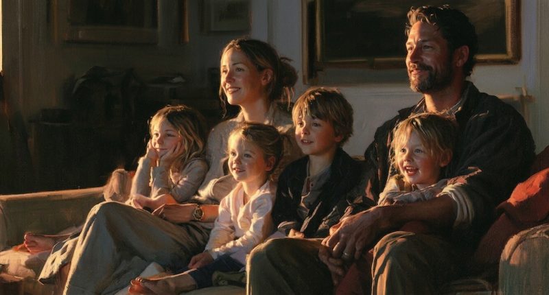 A family watching the best family movies you've never heard of together at home.