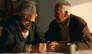 An older couple sharing a quiet breakfast, suggesting fidelity in marriage through ordinary daily commitment.