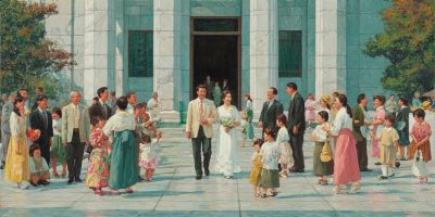 Japanese families gather on a temple plaza as a newly married couple exits, reflecting questions of identity and belonging central to the Mormon Stories lawsuit.