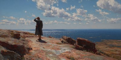  A man stands alone on a rocky coast looking out at the sea. Hope in hard times as deliverance appears small but real.