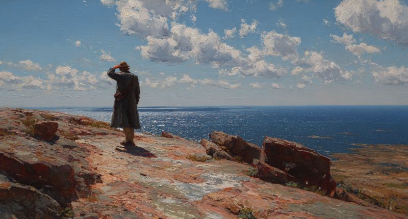 A man stands alone on a rocky coast looking out at the sea. Hope in hard times as deliverance appears small but real.