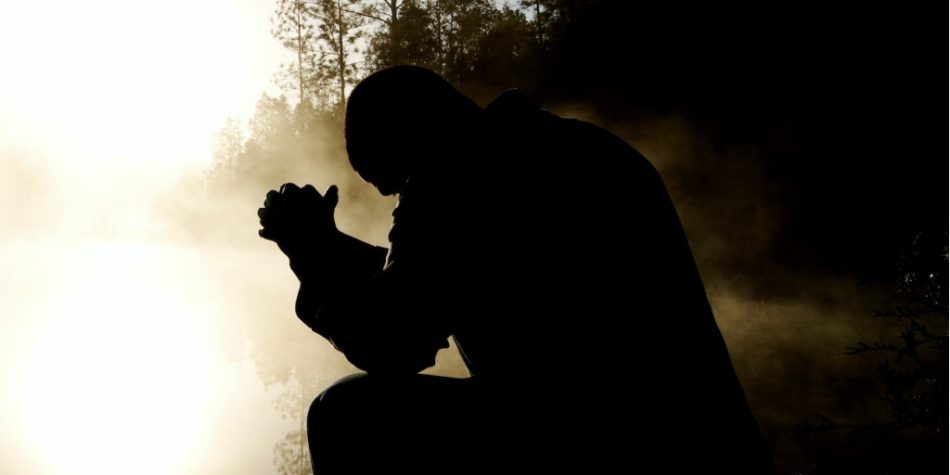 Man Silhouette Kneeling in Prayer w/ White Light & Trees | A Conversation with Faith Matters | Public Square Magazine | Illustrating Faith | Faith Matters Foundation