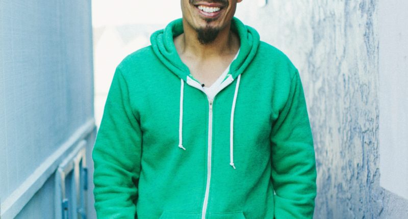 A Man Wearing Green Smiling | The Overwhelming Love of God & its Impact | Francis Chan Devotional on Celebrating God's Love
