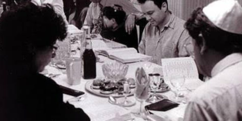 Black & White Photo of Jewish Family at Dinner | Sacred Experiences w/ Jewish Friends | Public Square Magazine | Do Jews Have Godparents | What to Say to Jewish Friends